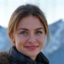 Portrait of Elara Vance, smiling, with a serene backdrop of mountains